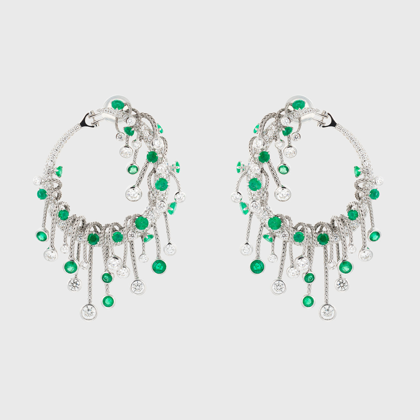 White gold earrings with white diamonds and emeralds