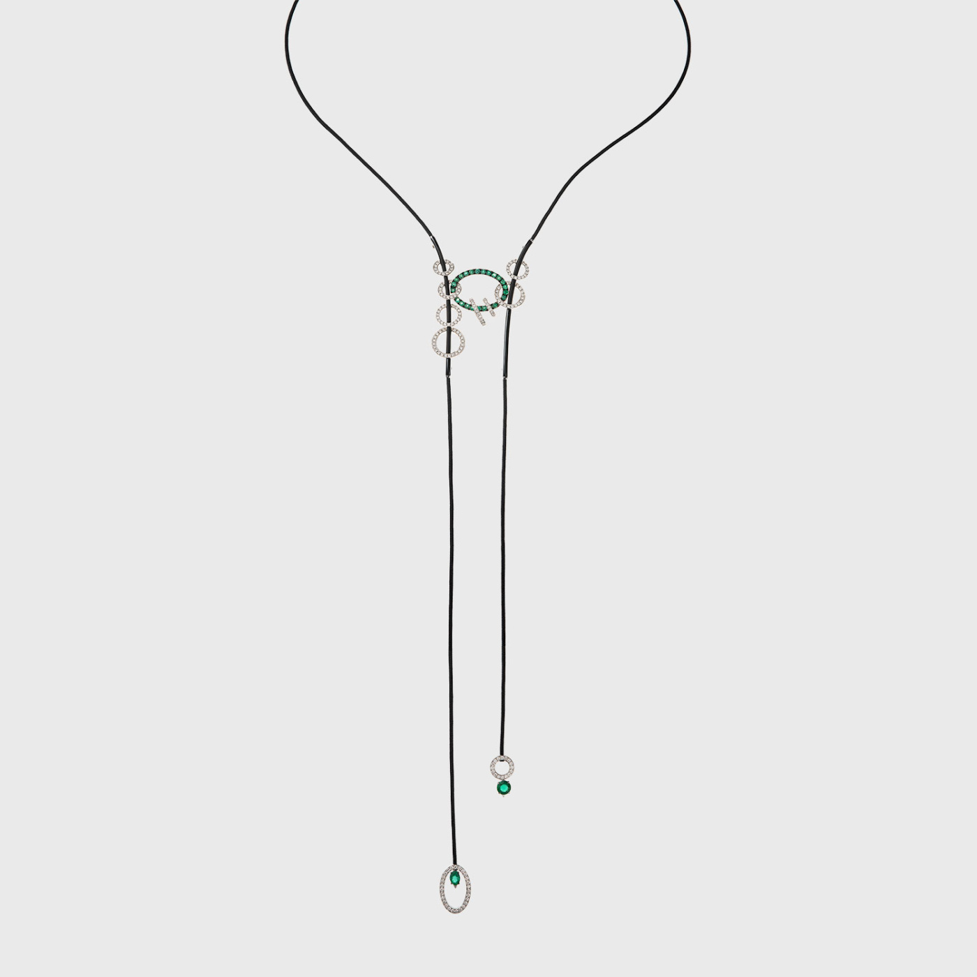 White gold long lariat necklace with white diamonds, emeralds and black enamel