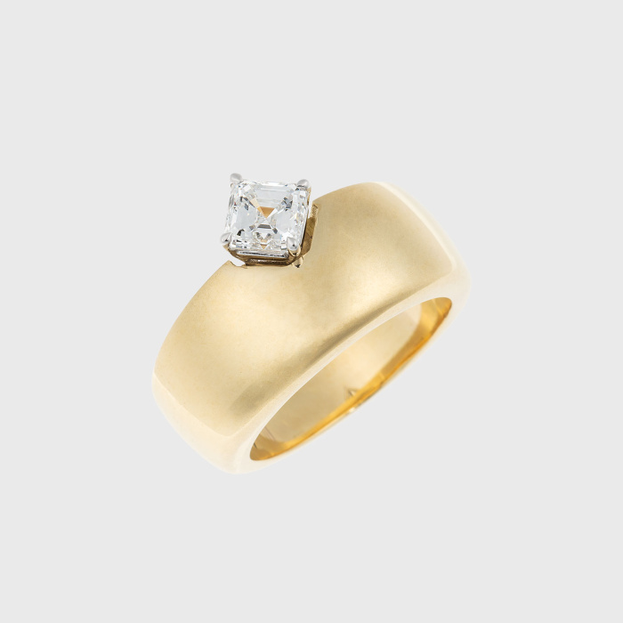 Yellow gold ring with square emerald cut white diamond
