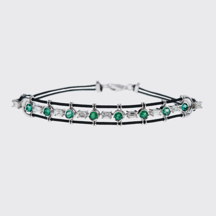 White gold bracelet with white diamonds and emeralds