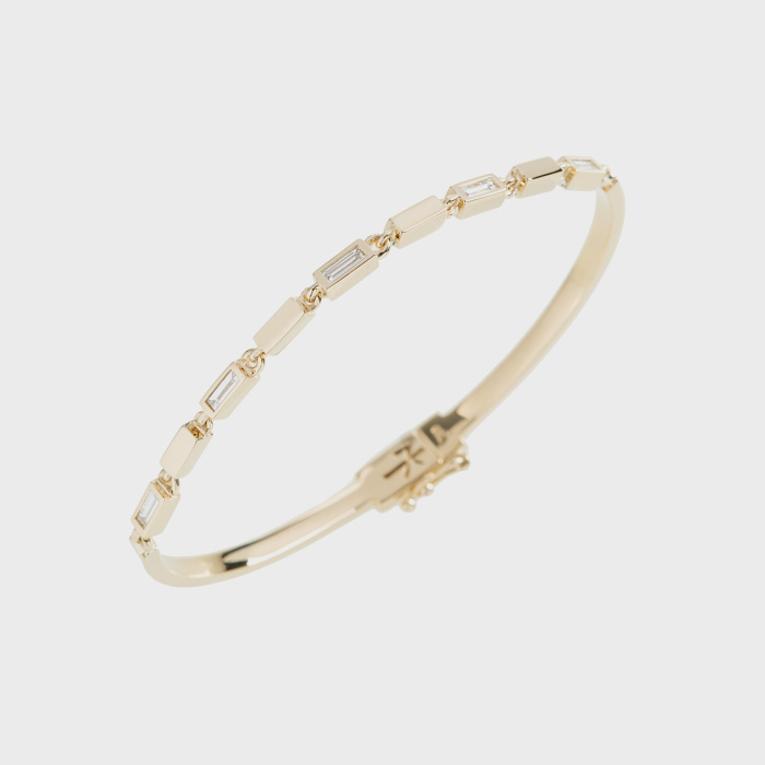 Yellow gold bracelet  with white diamond baguettes