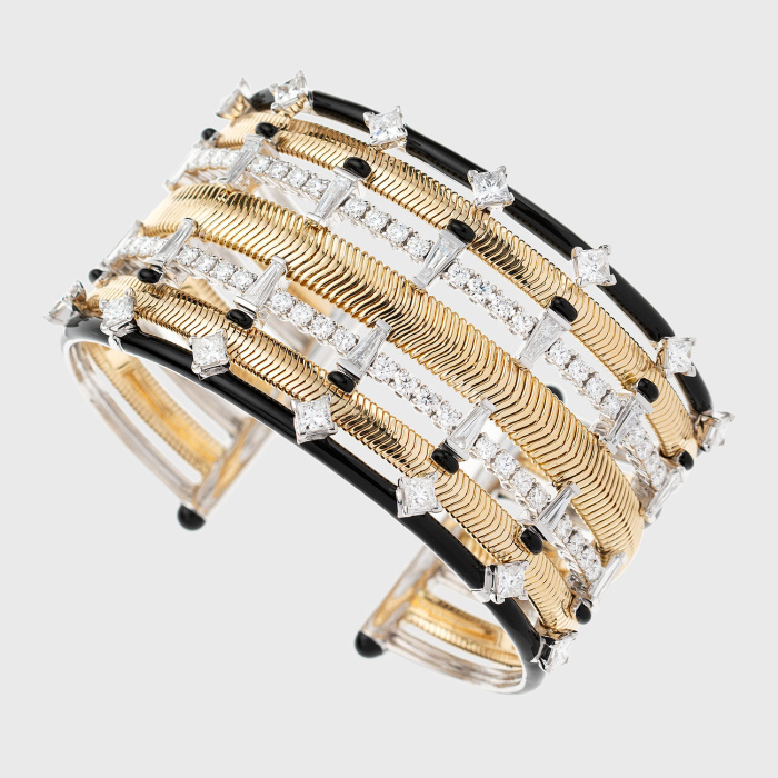 Yellow gold chain cuff bracelet with round, princess cut and tapered baguette white diamonds and black enamel