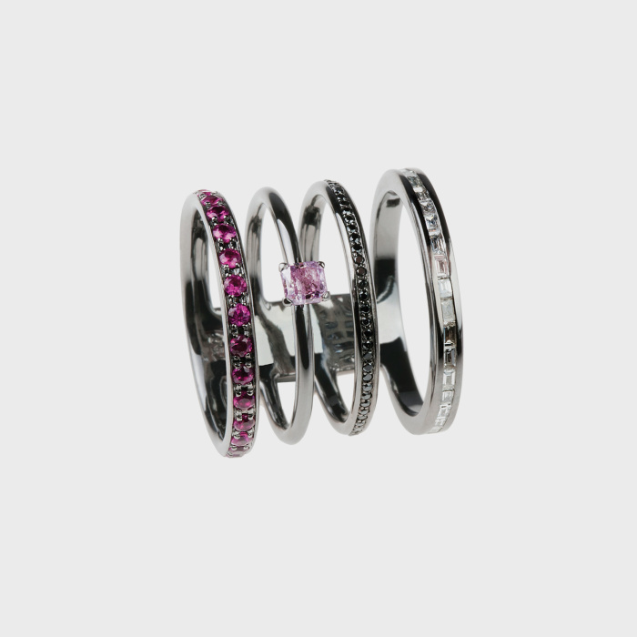 Black gold ring with black diamonds, white diamond baguettes, rubies and pink diamond