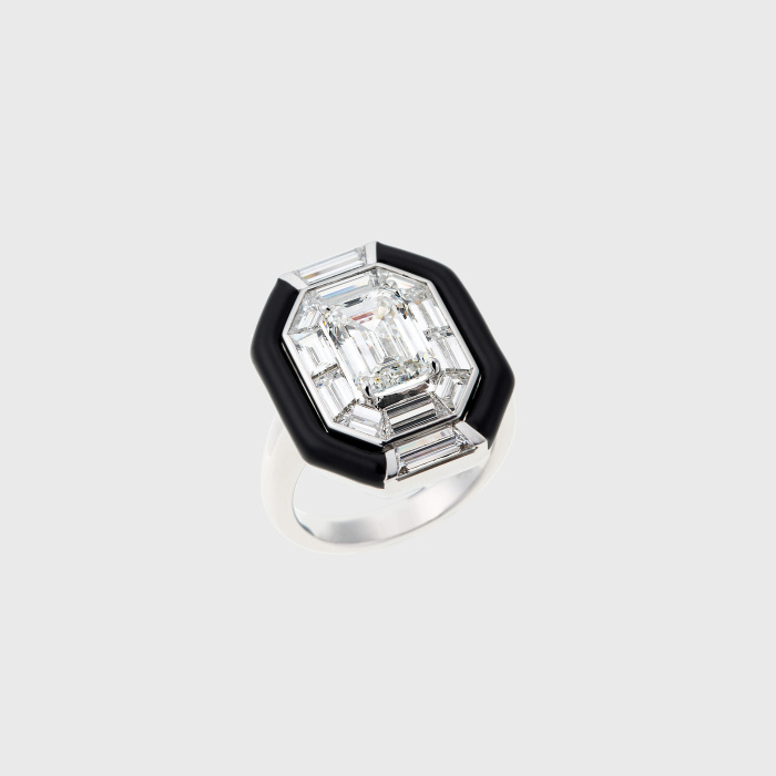 White gold ring with emerald cut white diamond, white diamond baguettes and black enamel