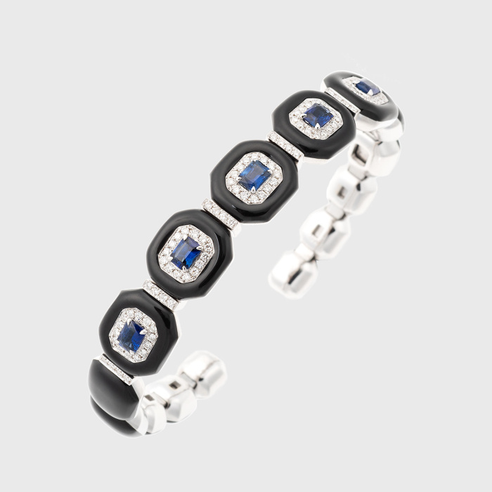 White gold bangle bracelet with blue sapphires, white diamonds and black enamel