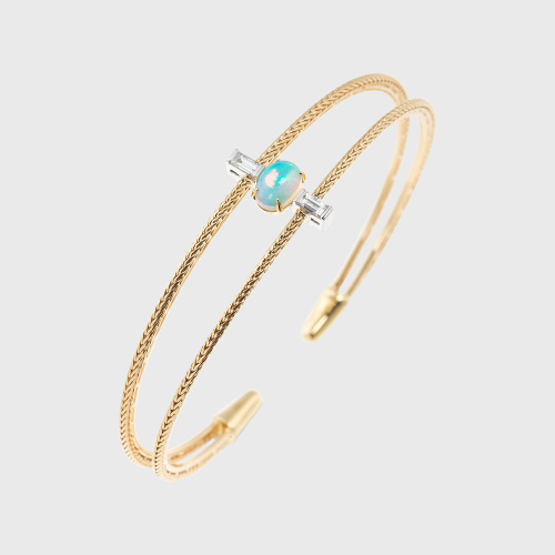 Yellow gold bangle bracelet with opal and white diamond baguettes