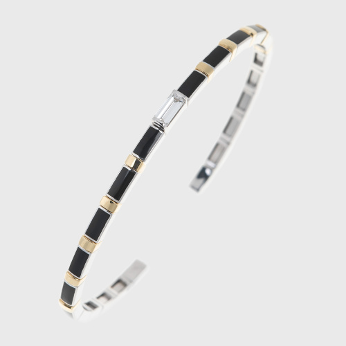 White and yellow gold bangle bracelet with white diamond baguette and black enamel
