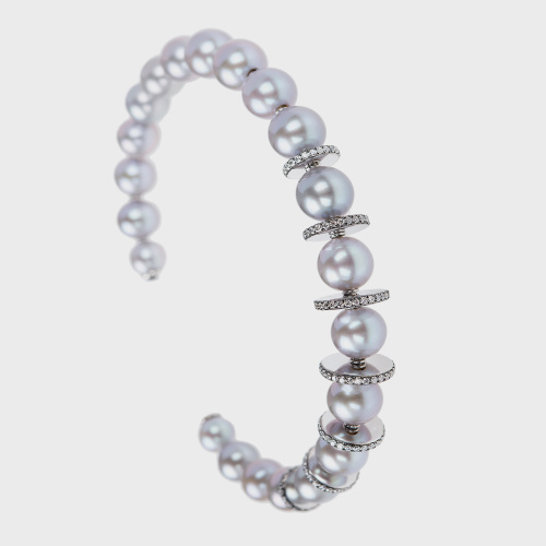 White gold bangle bracelet with white diamonds and silver pearls