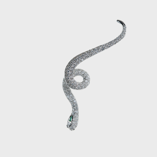 White gold snake earcuff with white diamonds and emerald