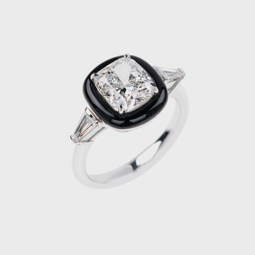 White gold ring with cushion cut white diamond, white diamond baguettes and black enamel