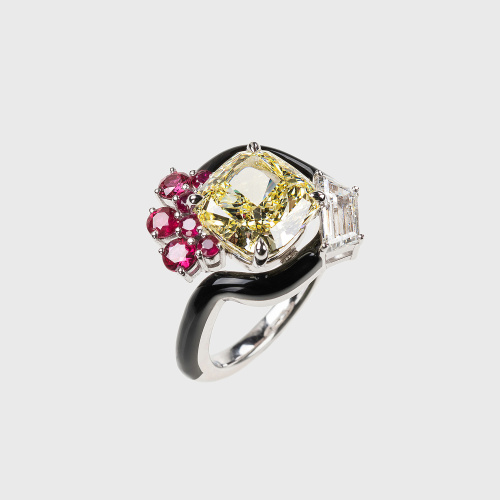 White gold ring with yellow diamond, rubies and trapeze white diamond and black enamel