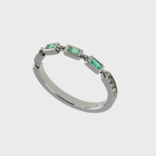 Black gold band ring with emeralds